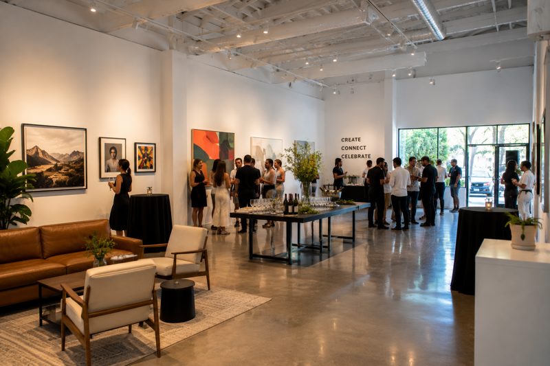 Bright Central LA gallery event space with people setting up for a small brand gathering