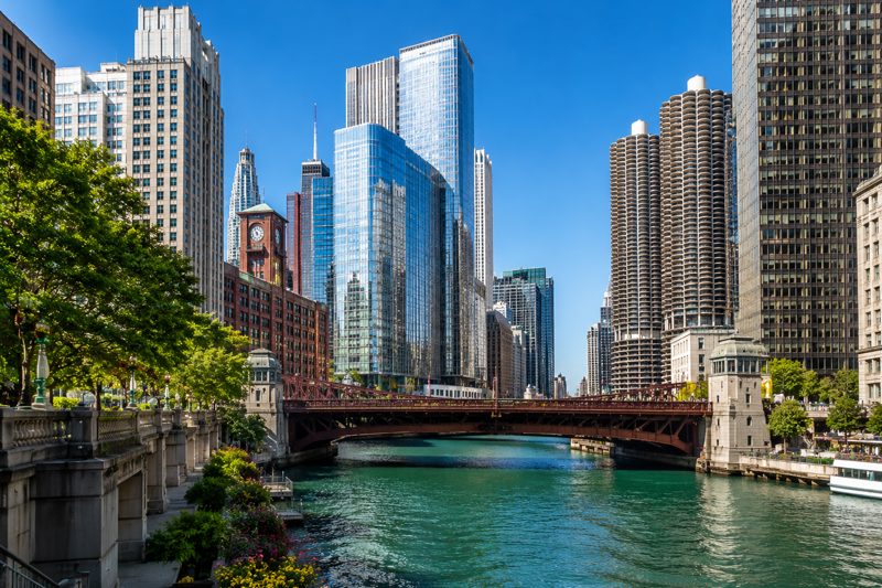 Chicago rooftop and waterfront event setting with skyline views, tables, lounge seating, and indoor-outdoor guest areas