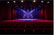 Theater stage with red seats and lights
