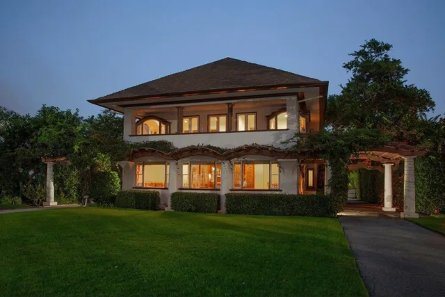 The Blinn House in Pasadena with historic architecture, lawn, and warm evening lighting