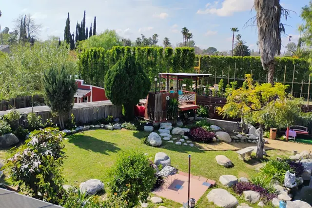 40 Palms ranch-style Reseda venue with a private driveway, palm trees, and a koi pond