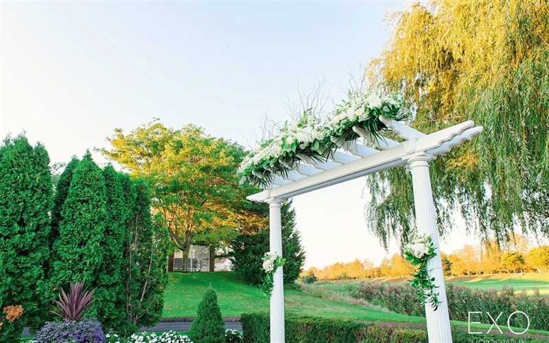Private Golf Club Ballroom With Terrace and Illuminated Bridge Views