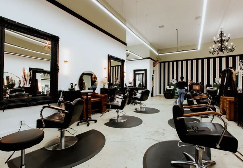 Stylish Striped Hair Salon with 18 Stations and Shampoo Lounge
