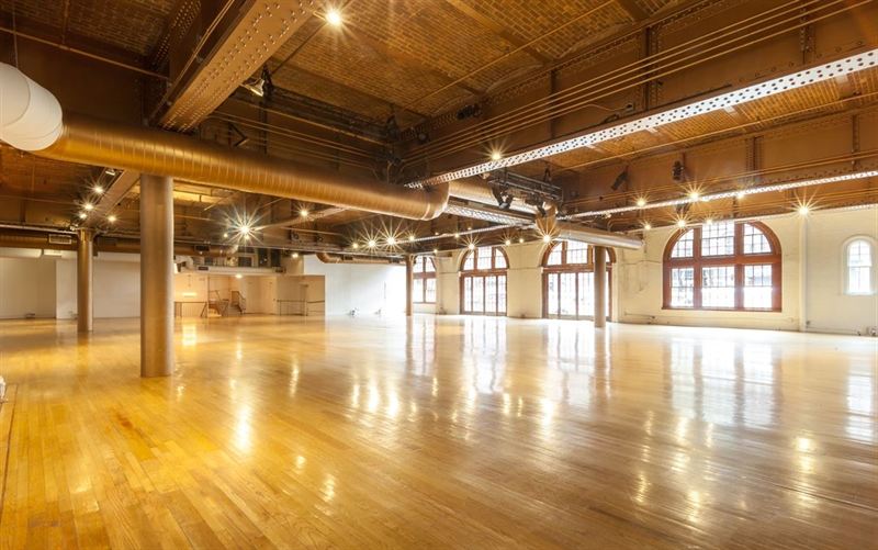 Historic Chelsea Carriage House With Brick Arches and Street-Level Load-In