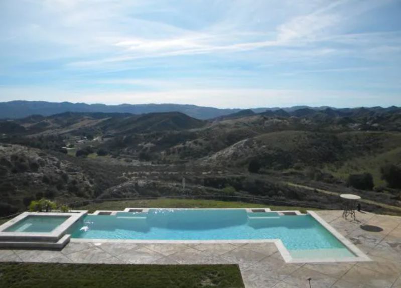 Gated Hilltop Estate with Infinity Pool, Mountain Views, and Huge Parking