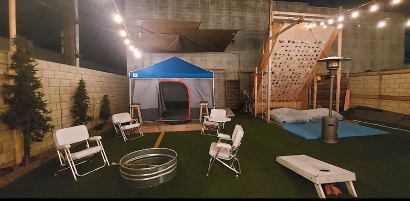 Outdoor Industrial Event Space with Bar Kitchen, Stages, and Fire Pits