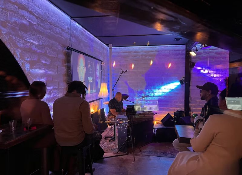 Boutique Podcast and Recording Studio with Speakeasy Vibe and Live Showcase Setup