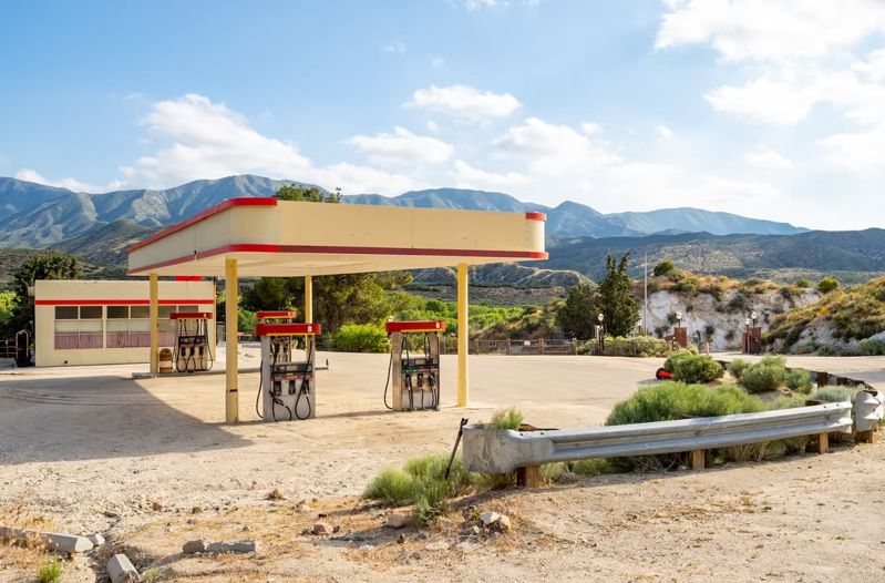 Movie ranch with diner, gas stations, cabins, junkyard, and mountain pads