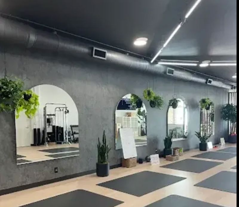 Bright Modern Fitness Studio with Natural Light and Equipment