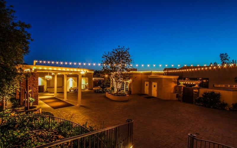 Romantic Courtyard Venue with Waterfalls, Gazebo, and Twinkle Lights