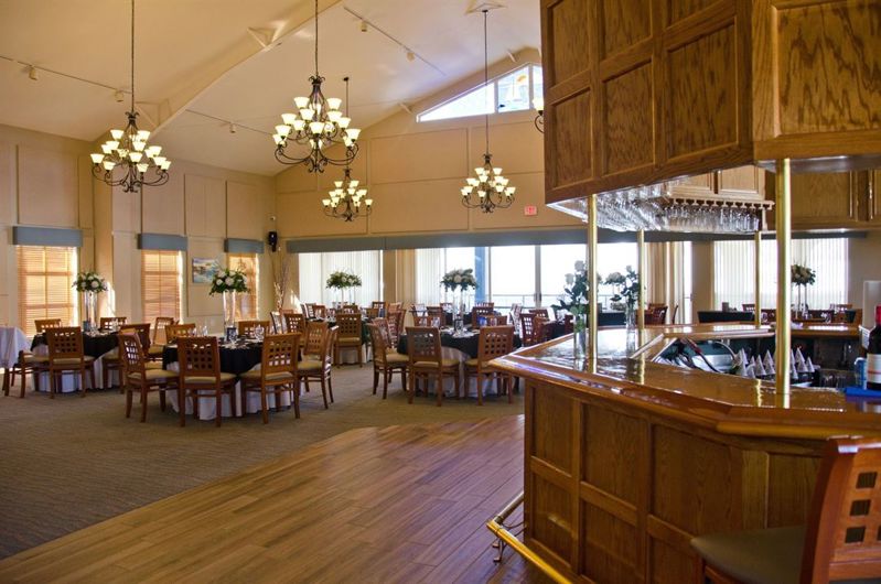 Waterfront Yacht Club Dining Room with Bar and Marina Views