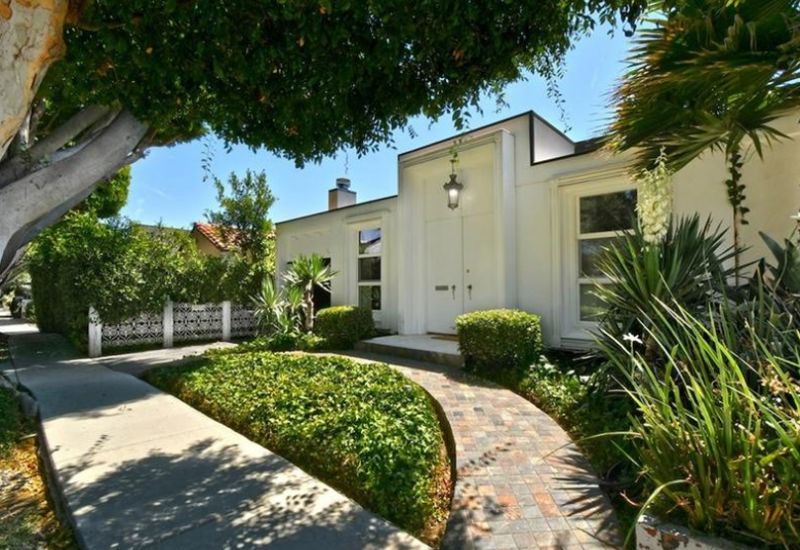 West Hollywood Home with Brick Patio, Fireplace, Chef's Kitchen, and Natural Light
